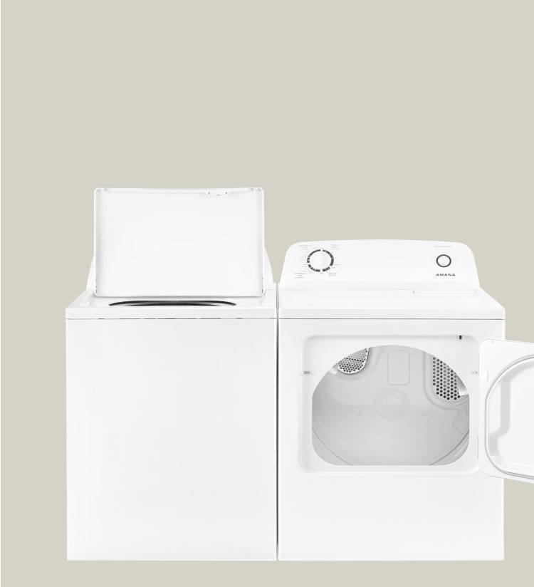 Amana® washer and dryer set with lids opened.