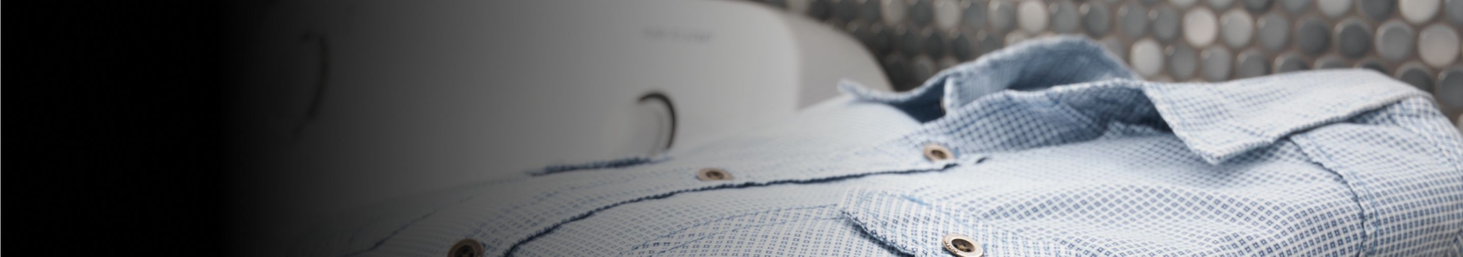 A folded blue button up shirt.