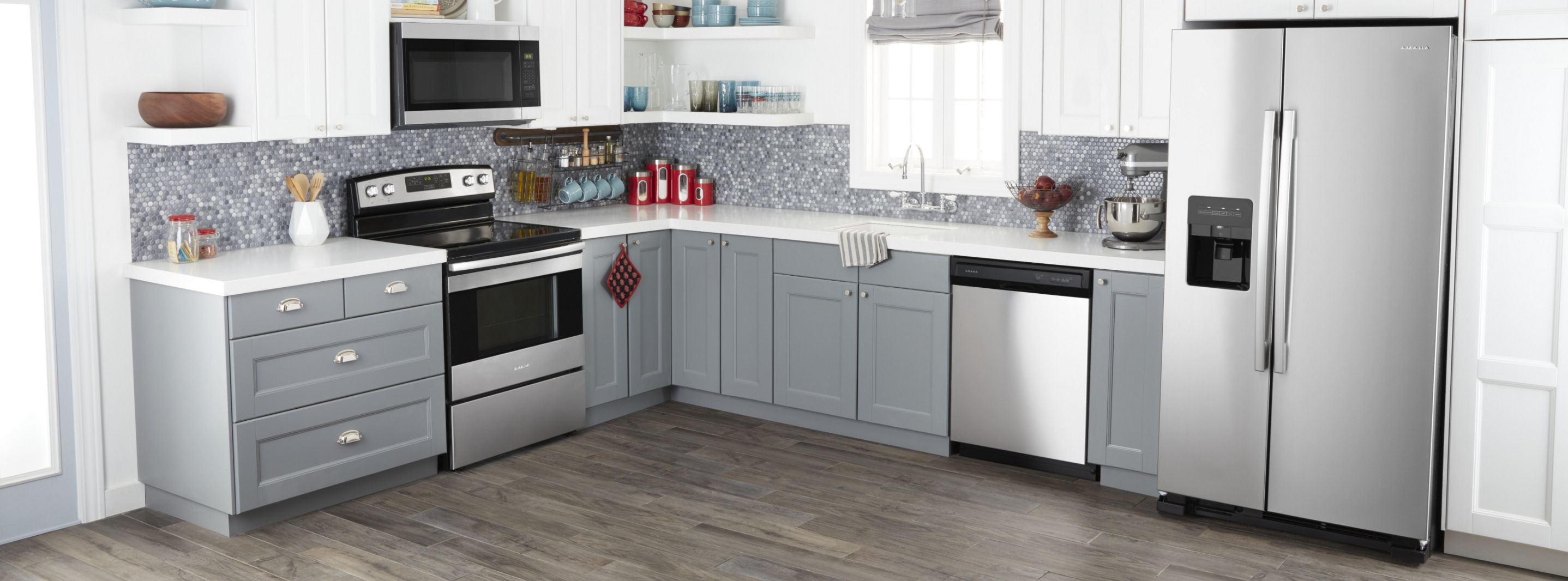 Amana® appliances set in gray cabinetry