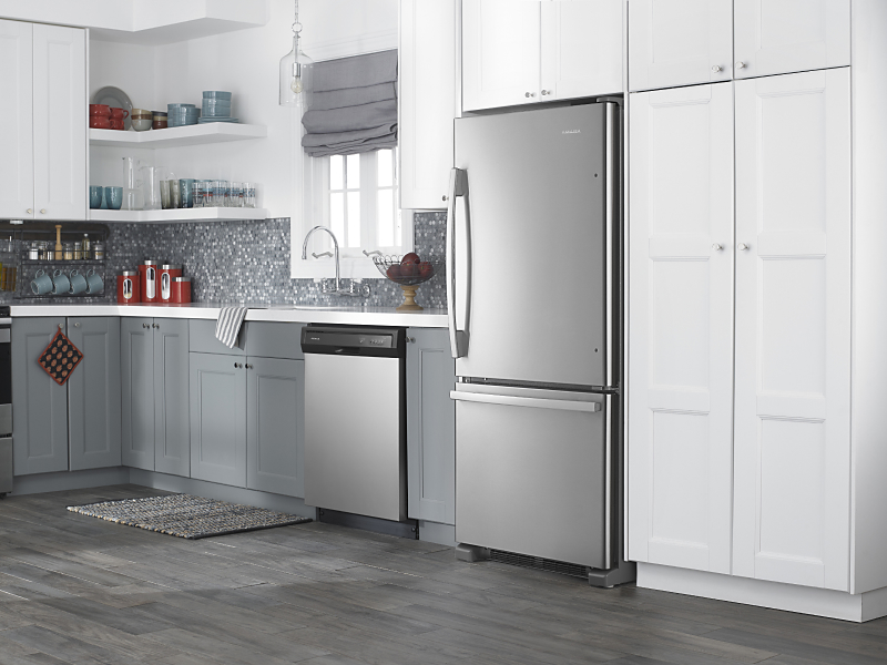 Amana® appliances set in white and grey cabinetry