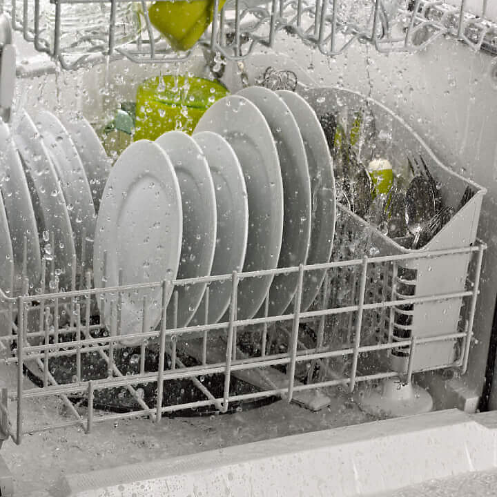Side interior view of dishes in dishwasher
