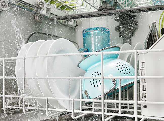Front interior view of dishes loaded in dishwasher