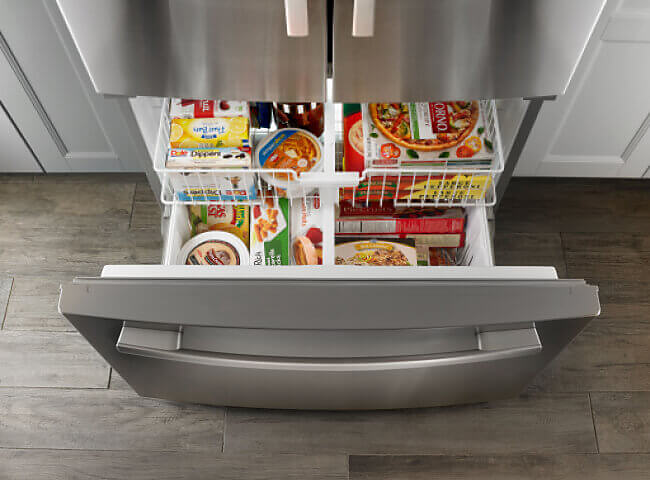 Refrigerator with bottom freezer drawer open