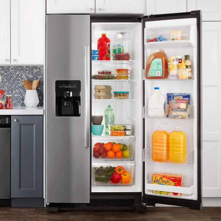 Amana® side-by-side refrigerator with door open