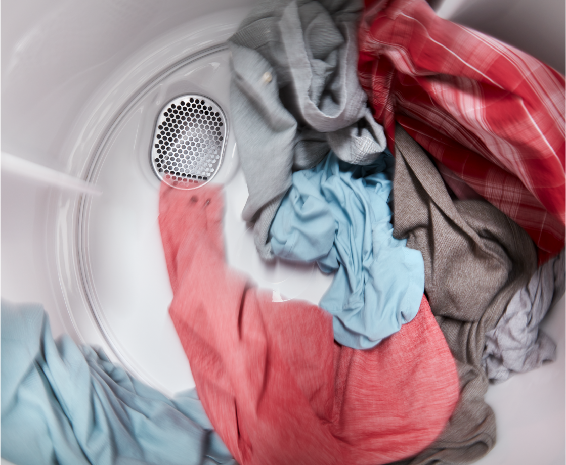 Clothes tumbling inside an Amana brand dryer