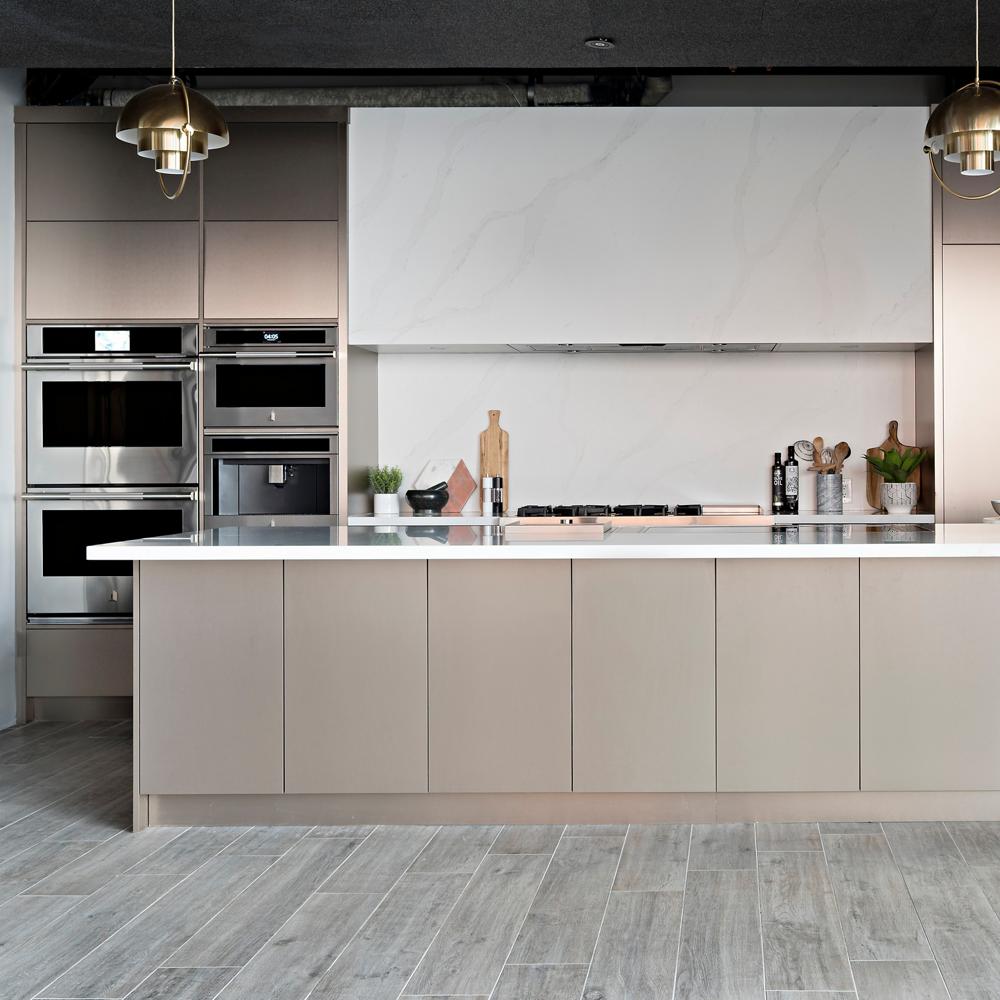 A luxury kitchen with neutral tones and JennAir appliances