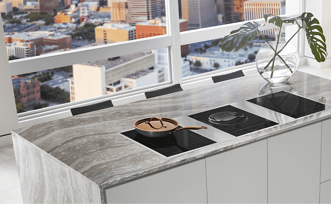 Three induction cooktops installed in an island in a luxury high rise condo. 
