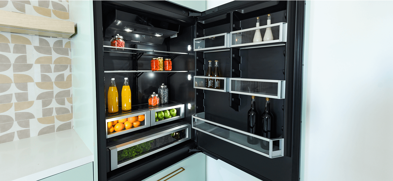 A JennAir Built-In Refrigerator in a modern, bright kitchen. 