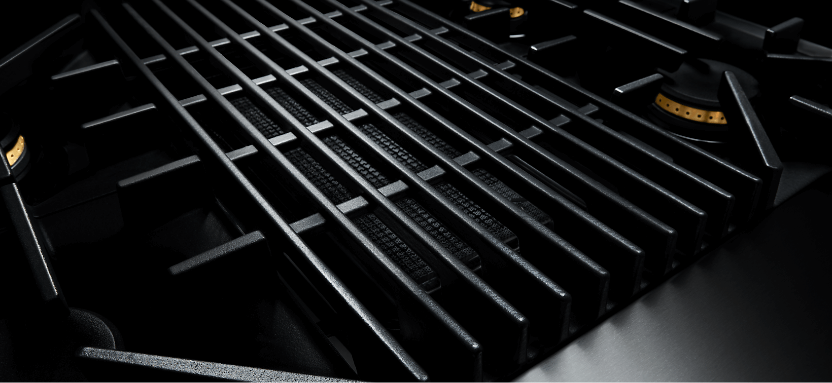 The cast-iron grates on a JennAir Gas Cooktop. 