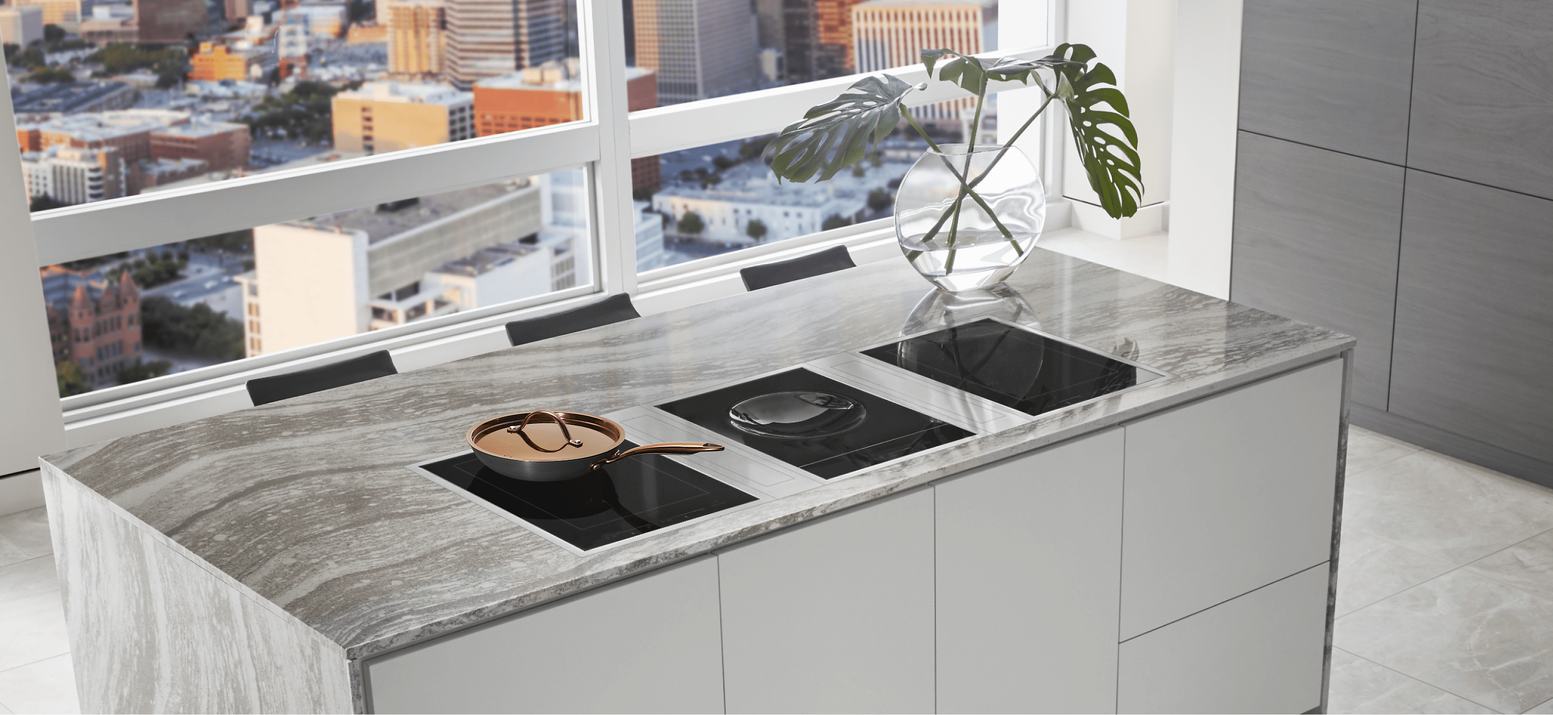 Three induction cooktops installed in an island in a luxury high rise condo. 