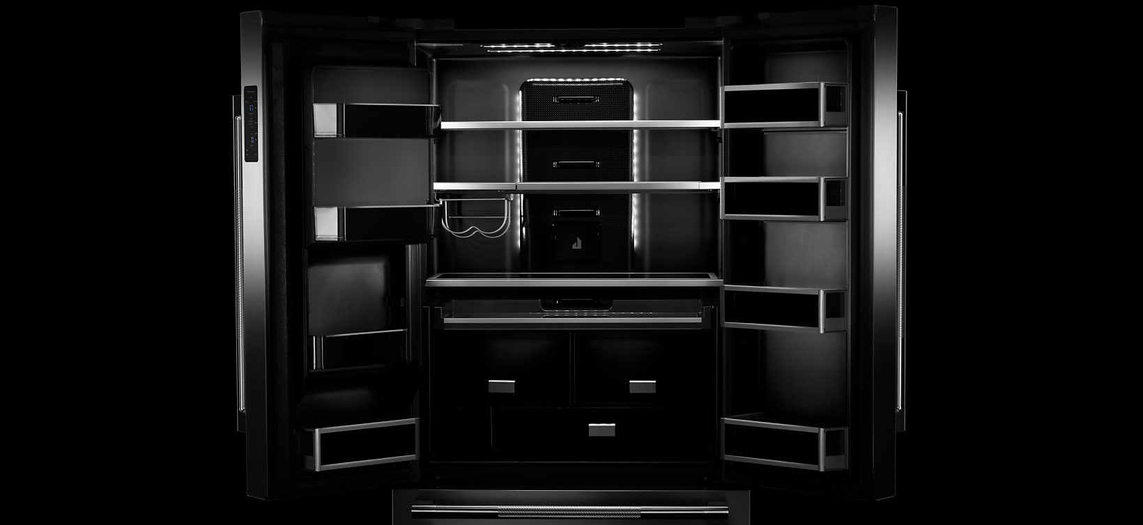 An open JennAir refrigerator. Showing the Daring Obsidian Interior. 