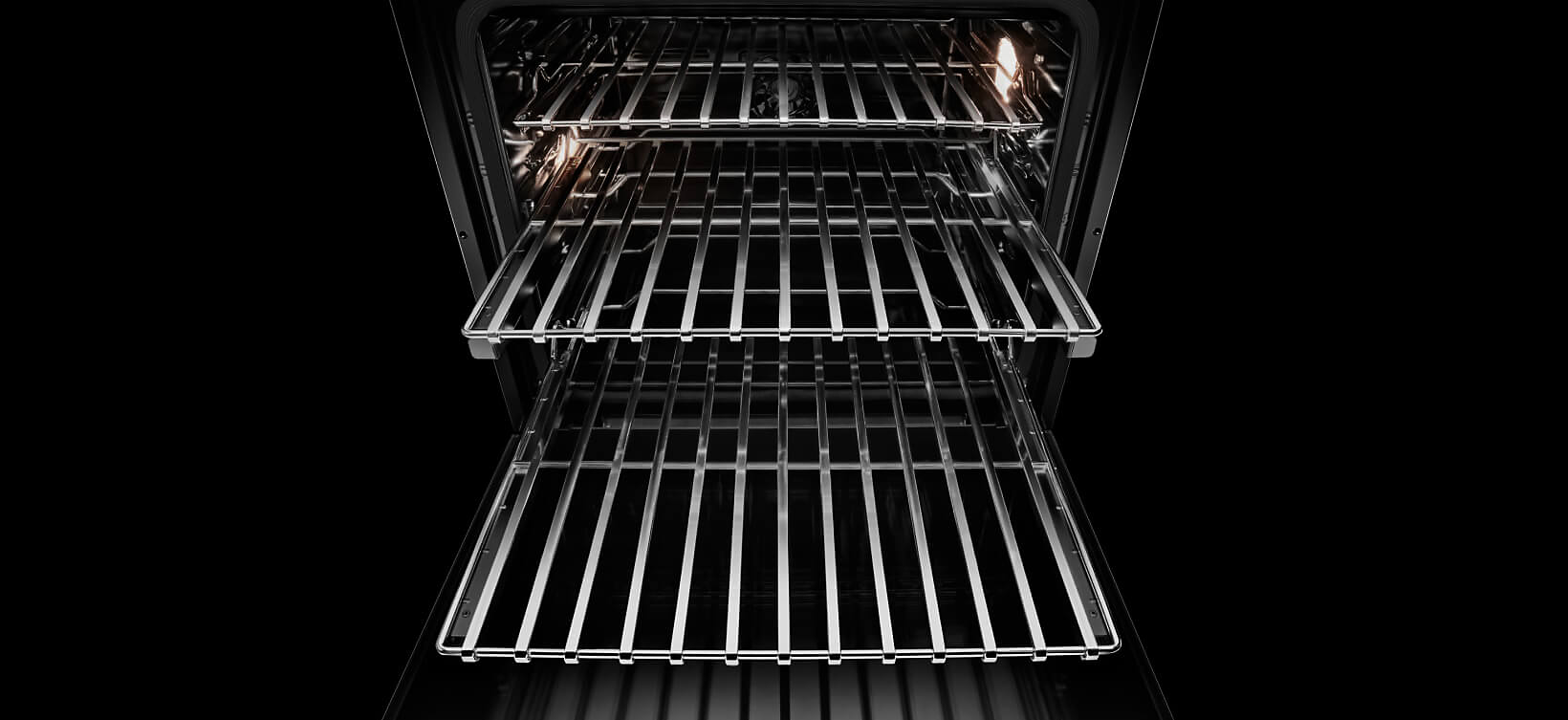 The racks pulled out of an open JennAir® wall oven. 