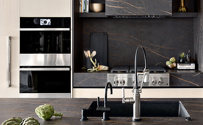 A modern kitchen filled with a suite of JennAir® appliances.