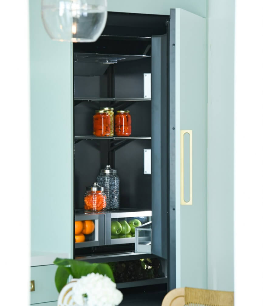 A JennAir® Built-In Refrigerator in a custom mint green panel.