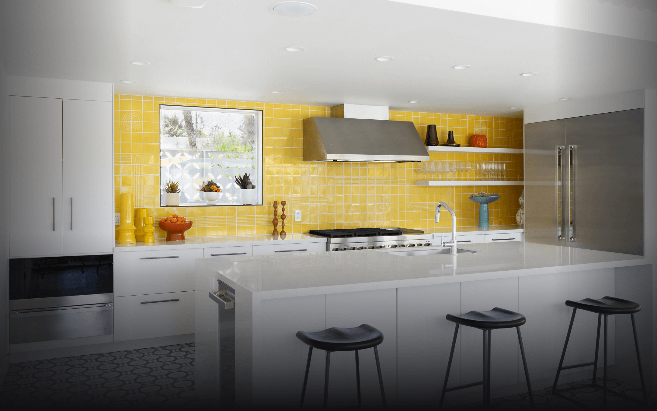 A JennAir® Professional-Style Range in a yellow kitchen.