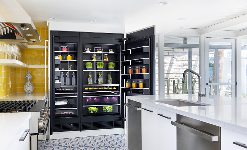 A whole-kitchen view featuring a pair of open JennAir® Columns with an Obsidian Interior.