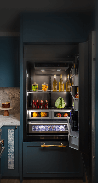 A real kitchen featuring a JennAir® Bottom-Mount Built-In Refrigerator.
