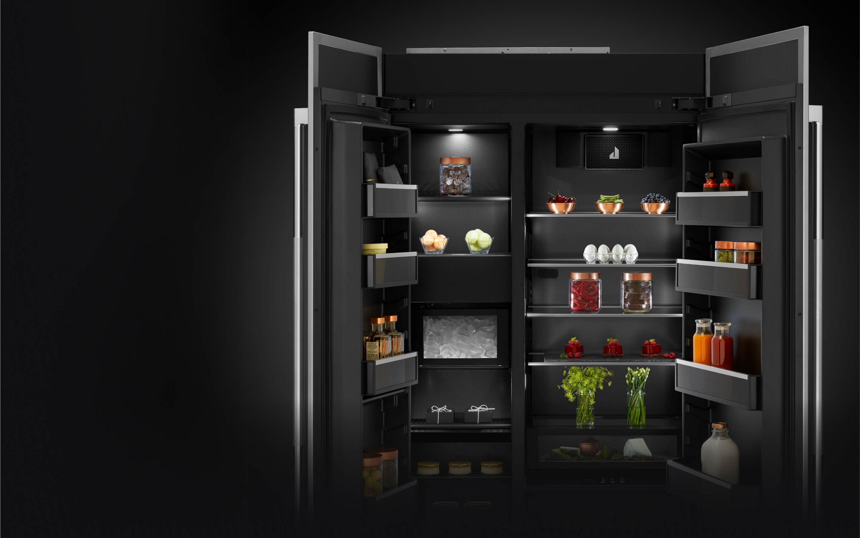 The rich dark interior of a JennAir® Side-By-Side Built-In Refrigerator.