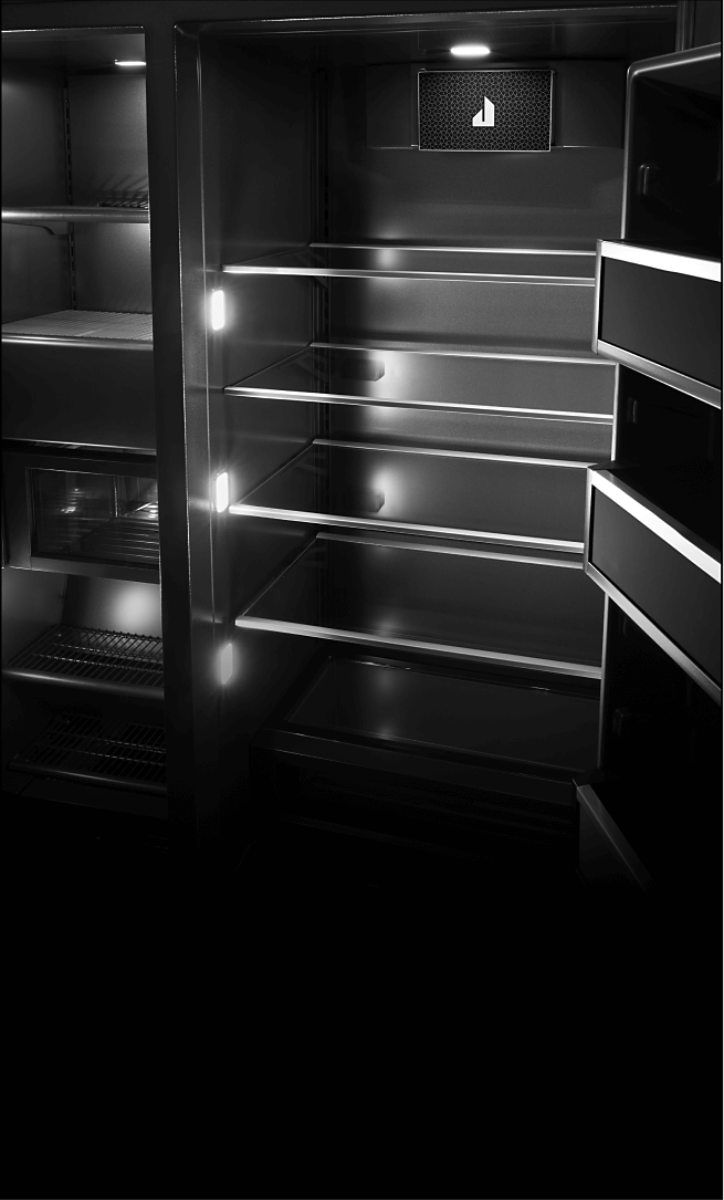 An open JennAir® Built-In Refrigerator, showing the multi-point lighting.