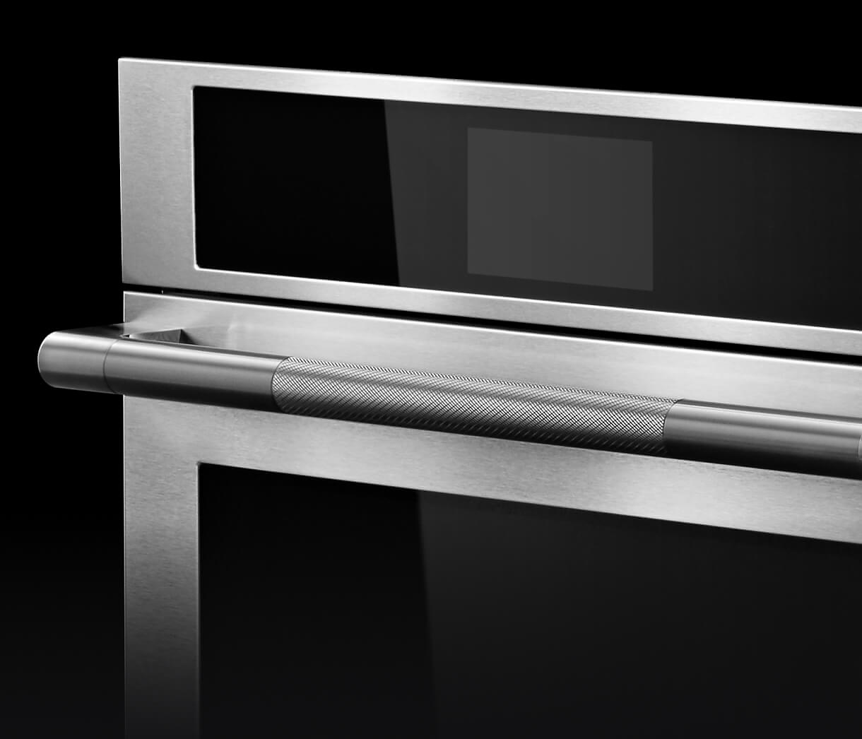 A close up of the knurling on the handle of a RISE™ Wall Oven.