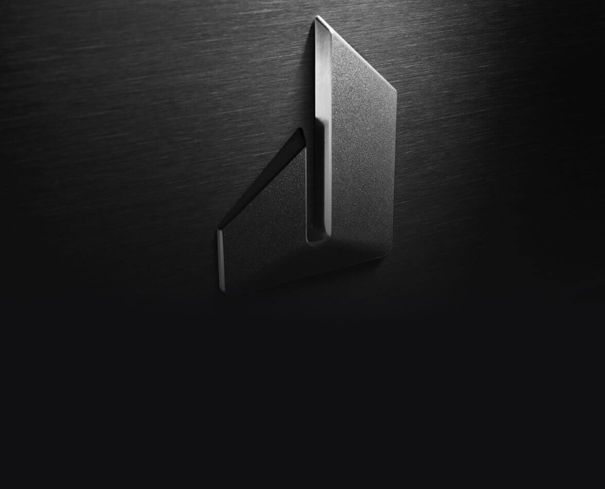 The JennAir defiant J badge isolated on stainless steel.