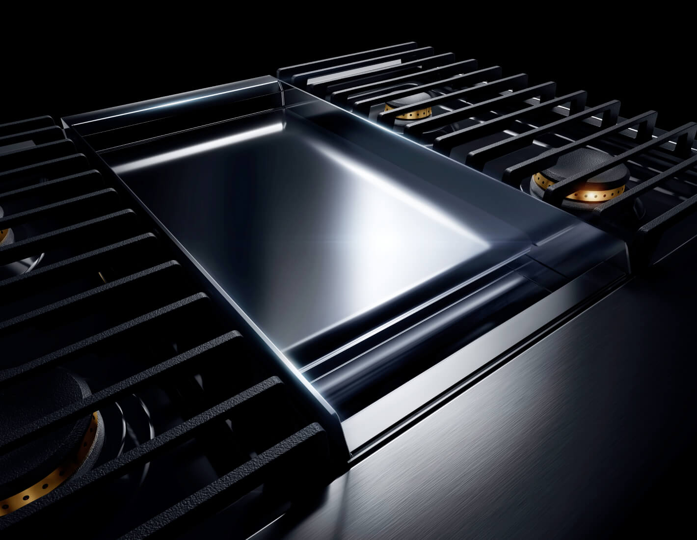 The chrome-infused griddle on a NOIR™ Design gas rangetop.