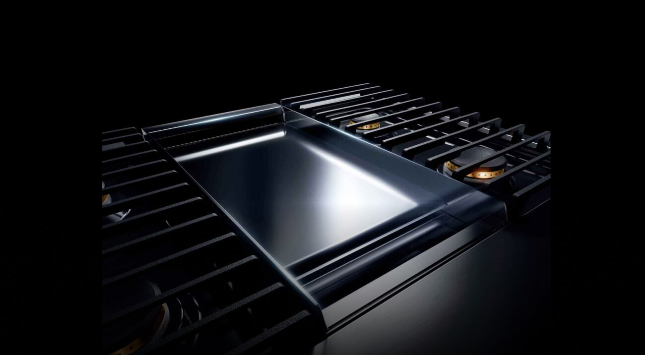 A JennAir® NOIR™ 48-inch range with a chrome-infused griddle.