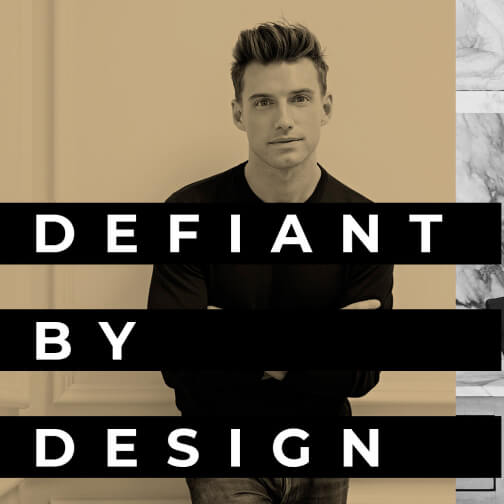 An industry rebel looking into the camera, with the words "Defiant by Design" overlaid. 