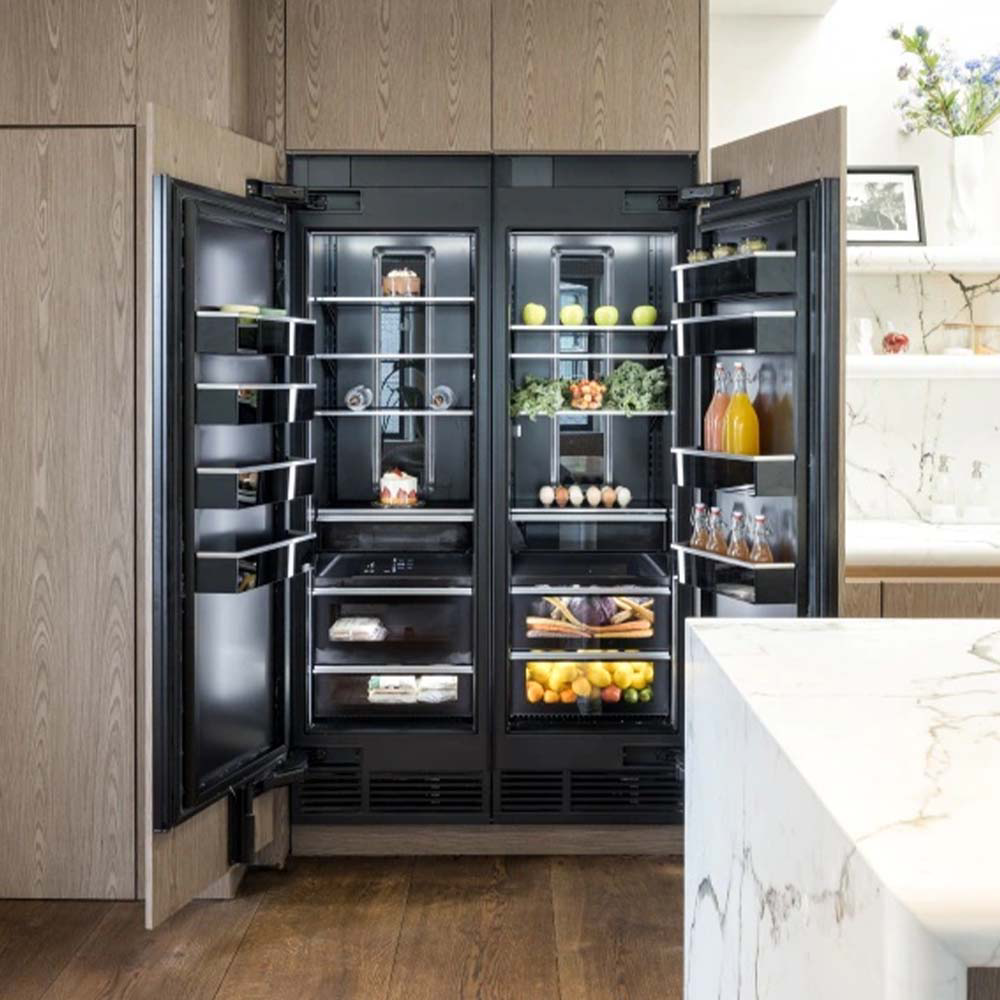 An open JennAir refrigerator in a bright, modern kitchen. 
