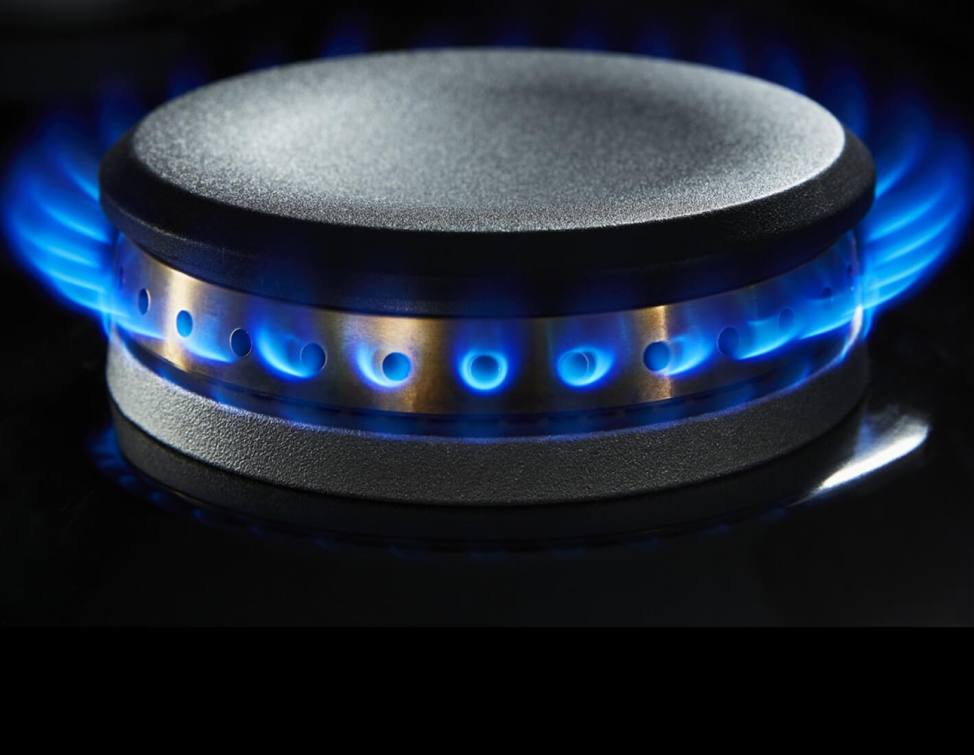 A lit dual-stacked burner.