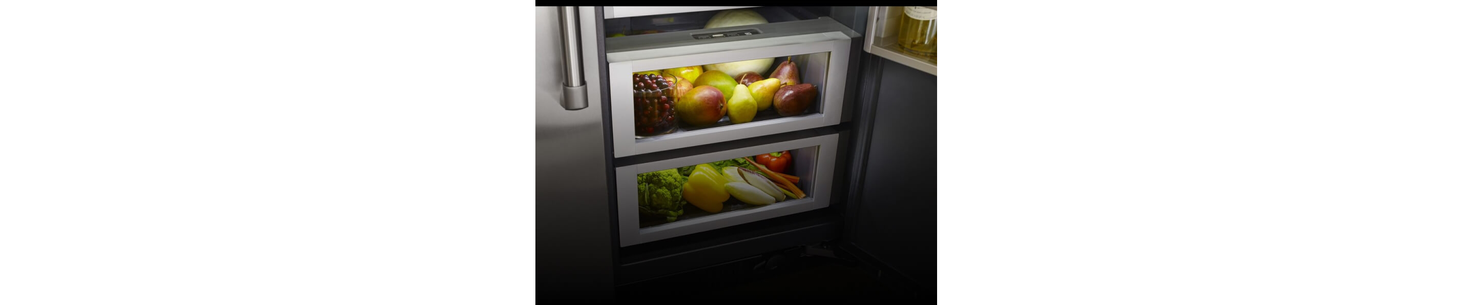 Climate-controlled produce drawers inside a JennAir® built-in refrigerator.