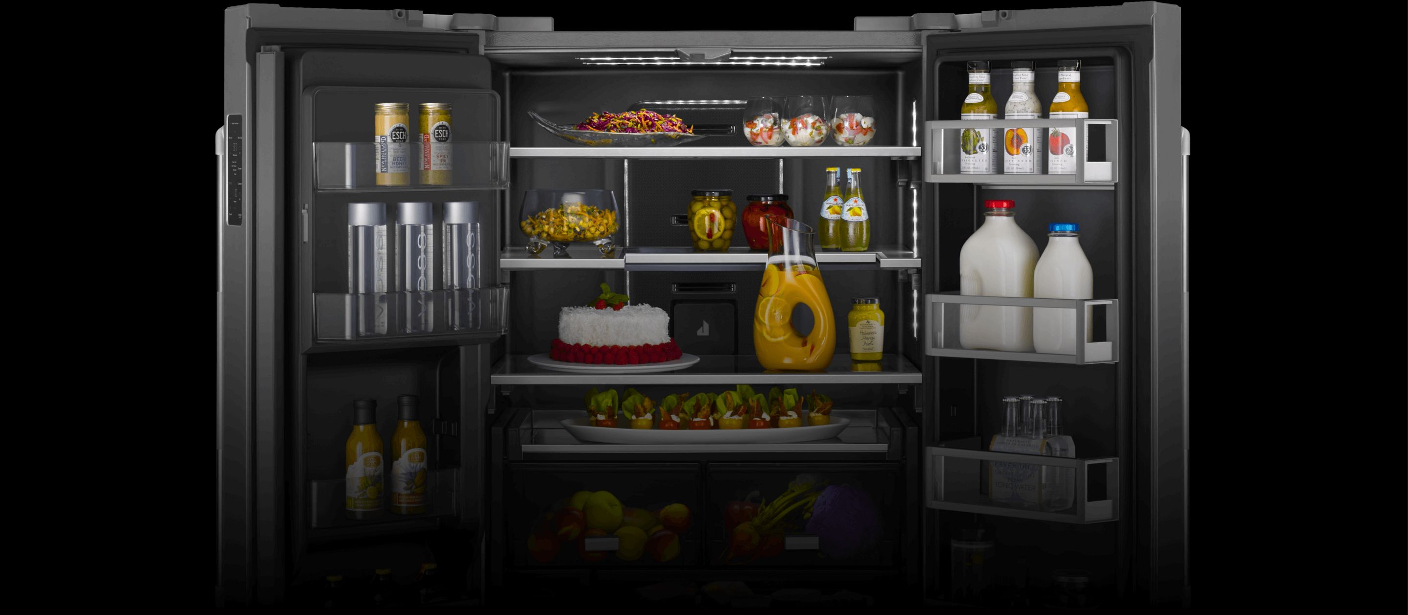An open JennAir® high-end freestanding French door refrigerator filled with vibrantly colored foods.