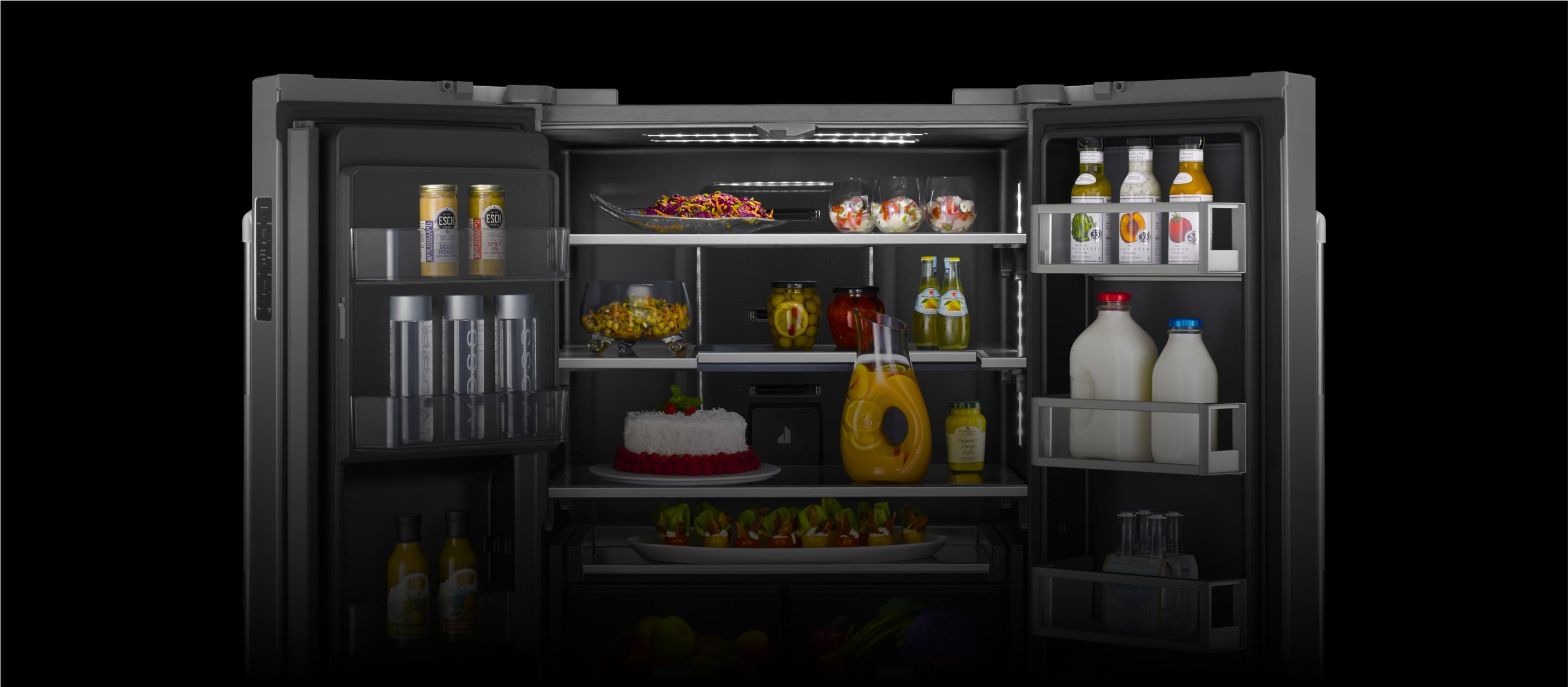 An open JennAir[®] high-end freestanding French door refrigerator filled with vibrantly colored foods.