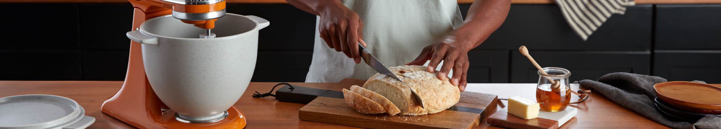 Slicing a flesh loaf of bread