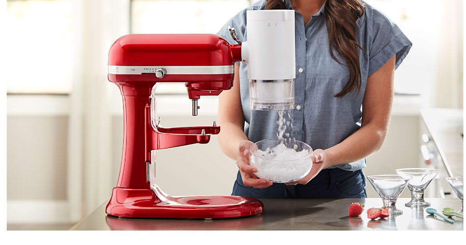 A woman making Hawaiian shave ice with a KitchenAid Stand Mixer