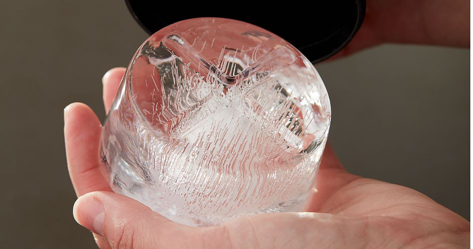 A person holding an ice mold