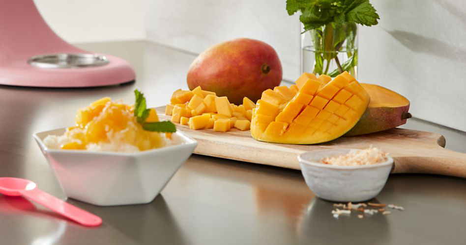 A serving station featuring chopped mango