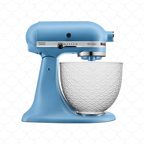 Light blue Stand Mixer in fornt of light textured background