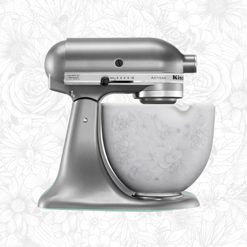 Stainless Steel Stand Mixer in front of white textured background