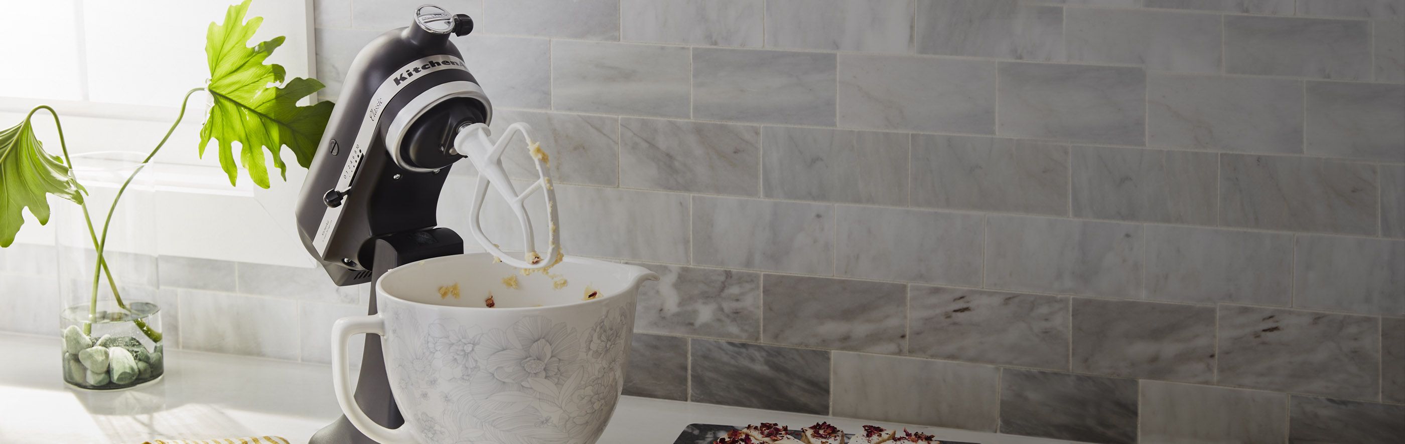 Closeup view of a KitchenAid® stand mixer in action