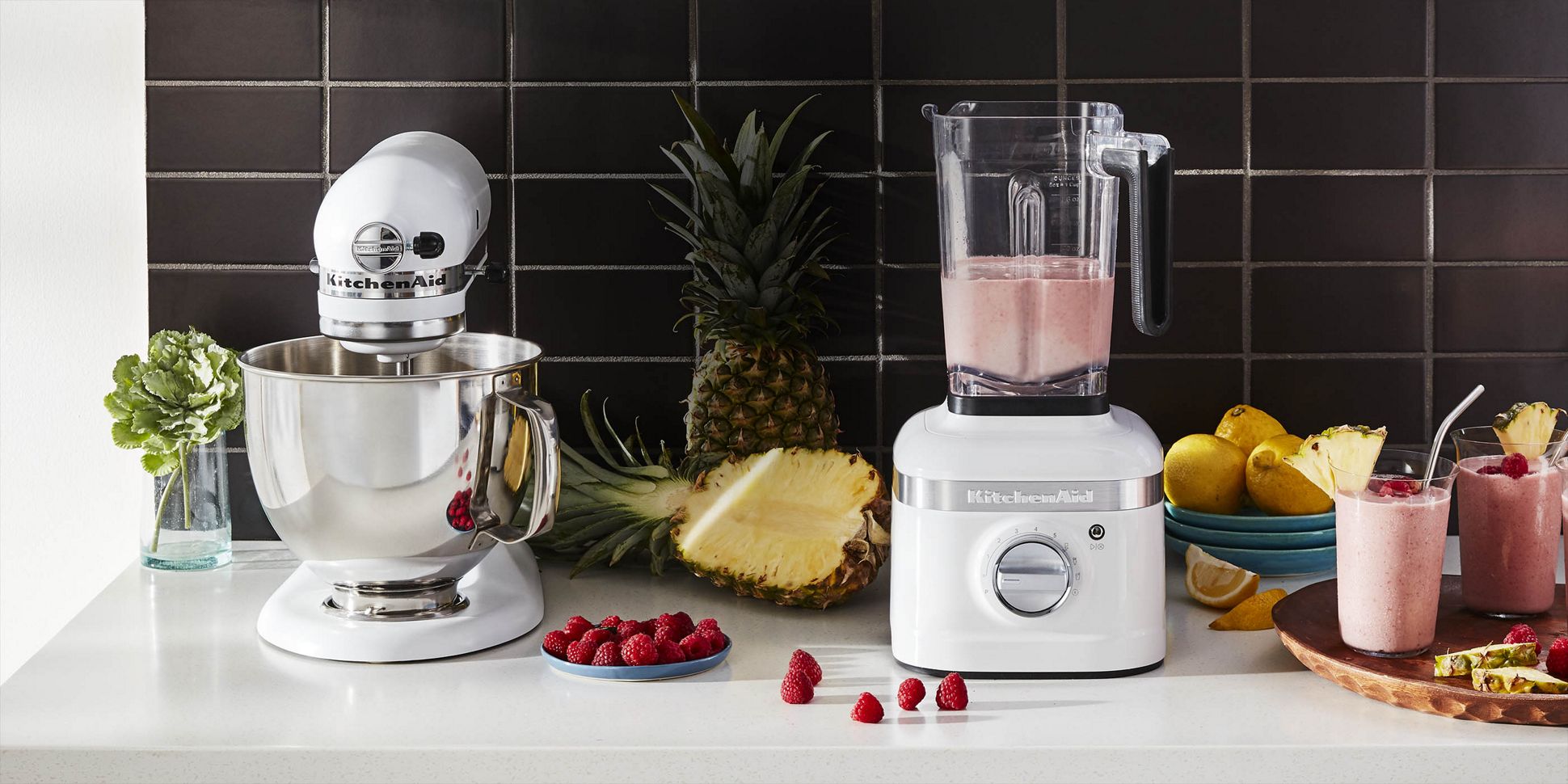 White Blender and Stand Mixer surrounded by tropical fruit.