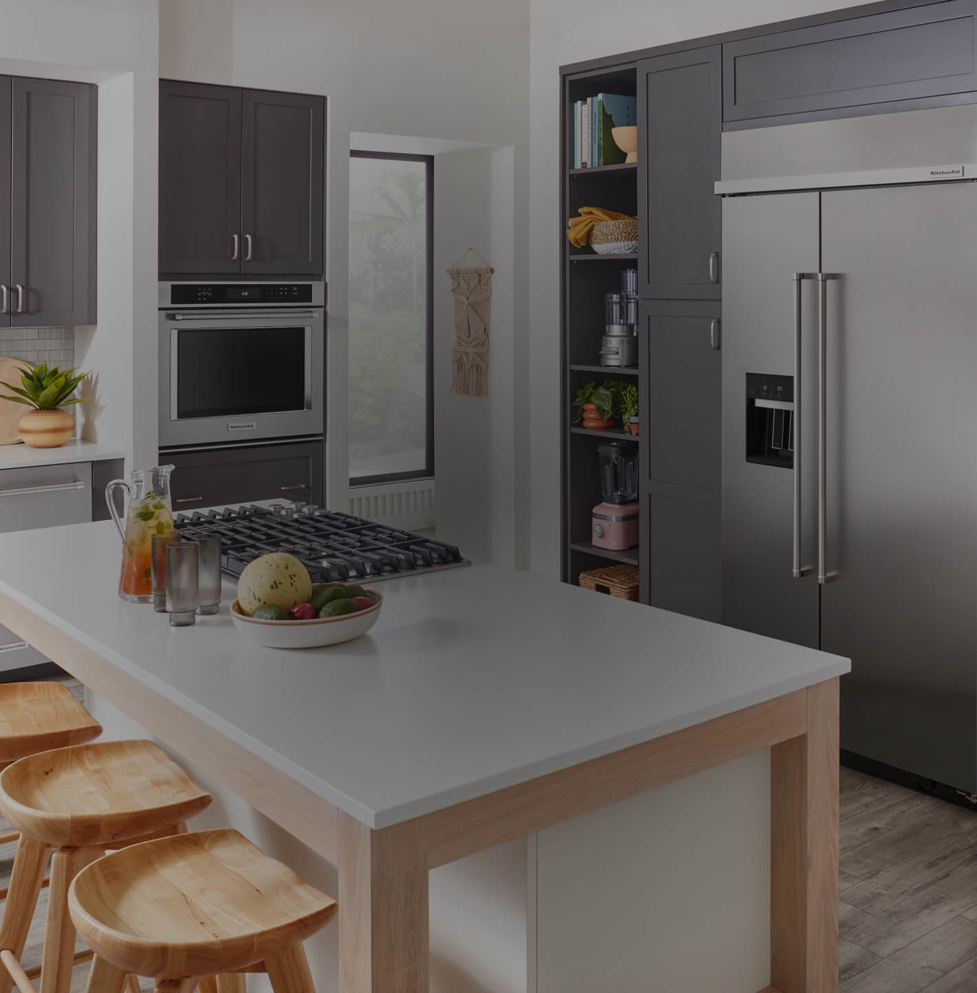 A kitchen outfitted in a complete suite of KitchenAid® appliances.