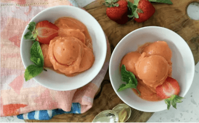 Two bowls of Healthy No-Churn Fruit Sorbet paried with mint and strawberries.