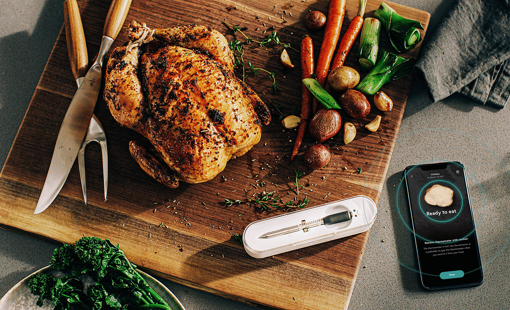 A roasted chicken and vegetables with the Yummly App and Thermometer.