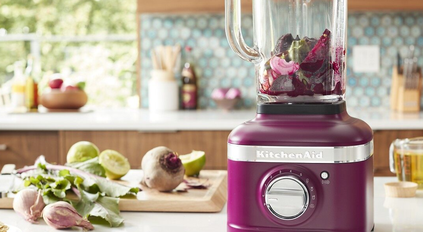 KitchenAid® countertop blender in Beetroot surrounded by ingredients