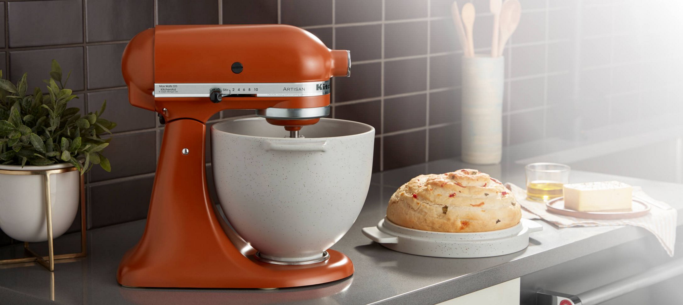 A Tilt-Head Stand Mixer with the Bread Bowl with Baking Lid.
