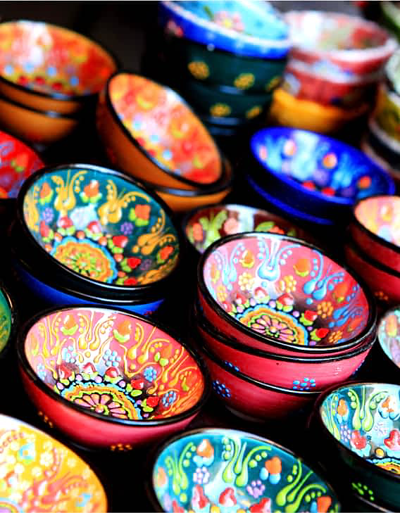 Colorful bowls with bold designs in various shades.