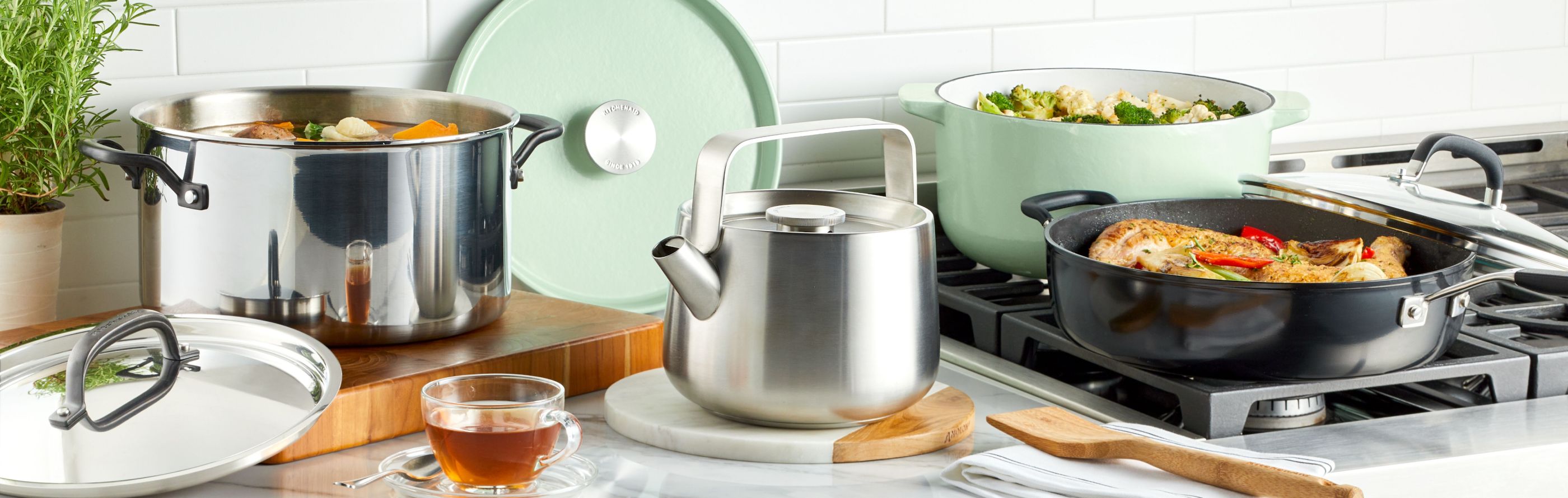 KitchenAid® Cookware being used over a stove.