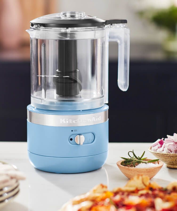 A close-up of KitchenAid Blue Velvet Cordless Food Chopper on a kitchen countertop.