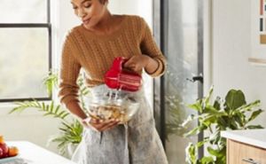 A person baking in her kitchen.